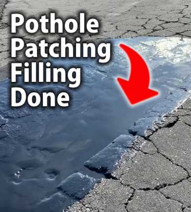 Close-up view of a repaired asphalt crack and pothole, filled with hot bitumen filler, with a smooth, black surface.